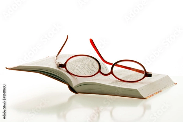 Obraz red reading glasses on the pages of an open book