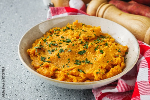 Obraz delicious mashed sweet potatoes on a light stone background