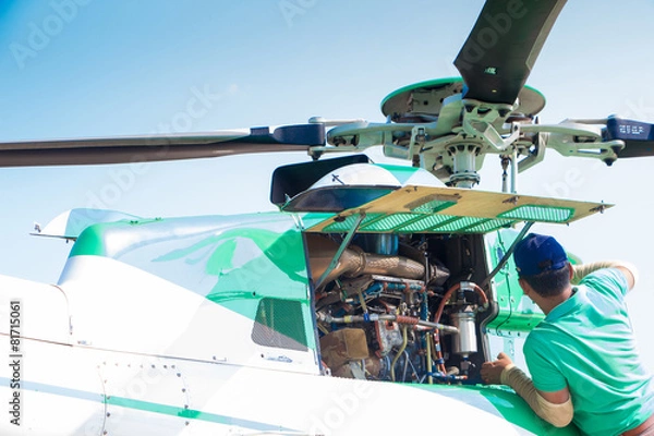 Obraz Engineer maintaining a helicopter Engine