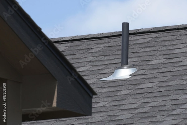 Obraz Duplex home rooftop ventilation pipe.