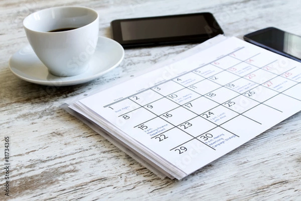 Fototapeta Checking monthly activities in the calendar