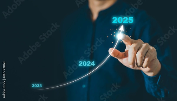 Obraz Businessman hand drawing arrow line with increasing direction from year 2023 to 2024 to 2025 for forecasting of business plan growing in long term, Happy New year with business growth plan concept