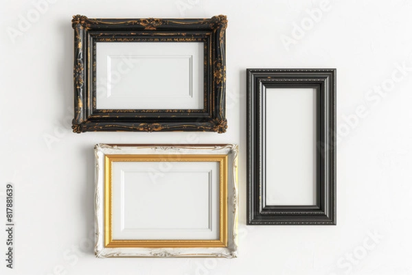 Fototapeta Three framed pictures are hanging on a wall, with one of them being a black