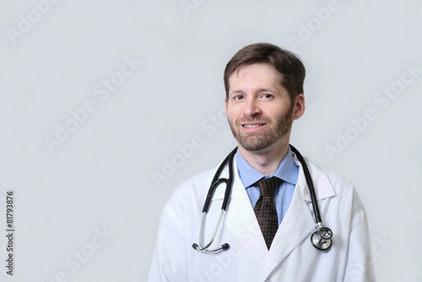 Obraz Smiling Physician with beard wearing stethoscope
