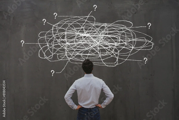 Fototapeta business man looking for solution, understanding and clarity about complex problem, brainstorm