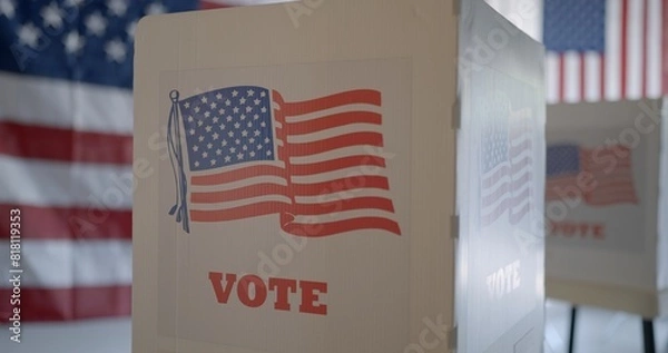 Fototapeta Close view, row of voting booths at polling station in United States. US flag on back wall