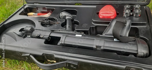 Obraz A metal detector used to search for mines. Cleaning of territories contaminated by land mines. The process of humanitarian demining.