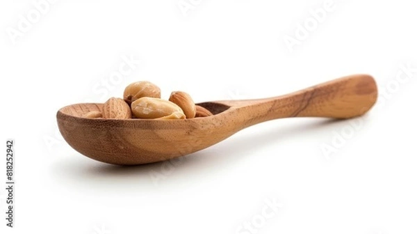 Obraz roasted peanuts in a wooden spoon healthy snack isolated on white background stock photo