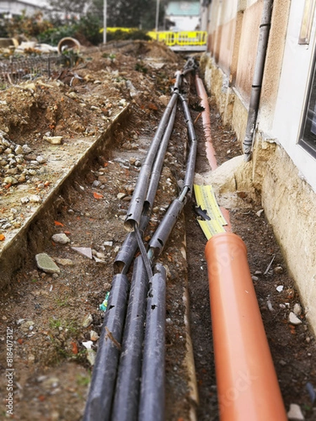 Obraz broken pipes at construction site on city streets to change with new ones