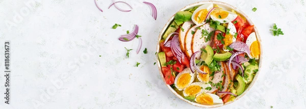 Fototapeta Healthy cobb salad with chicken, avocado, tomato, red onions and eggs. American food. Top view, banner