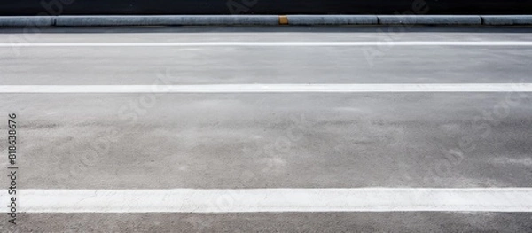 Fototapeta Street parking spot with a white line for cars with copy space image
