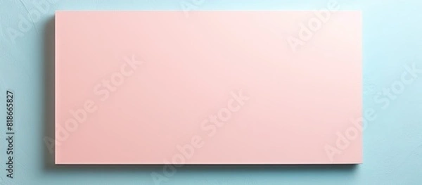 Fototapeta Closeup of a vintage abstract sky cardboard craft with a light blue color paper background and a white and pink border This presentation template and mockup offers ample copy space for your design