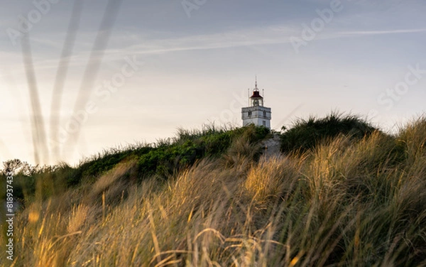 Obraz Leuchtturm hinter den Dünen