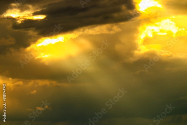 Obraz sun rays and clouds with sunset colors