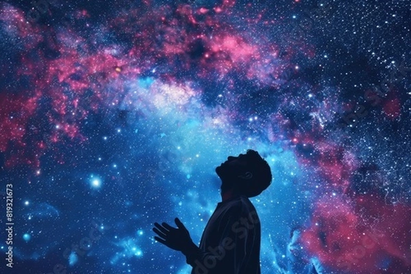Fototapeta Silhouette of man in worship against composite image of starry sky. Worship