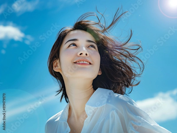 Fototapeta 空を見上げる女性