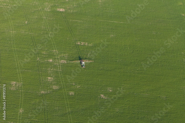 Obraz aerial view of harvest fields with tractor
