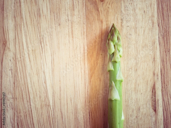 Fototapeta asparagus on wooden table with filter effect retro vintage style