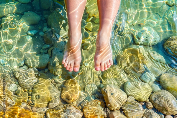 Obraz Children's feet in the water of the lake