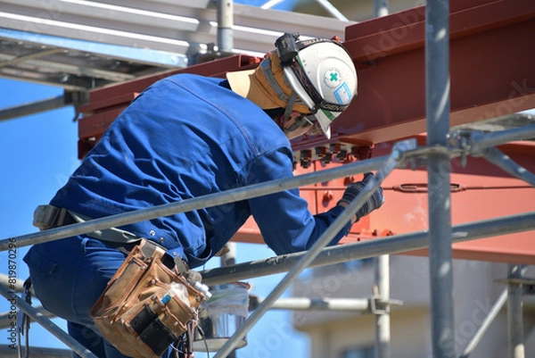 Obraz 工場新築工事・働く男性