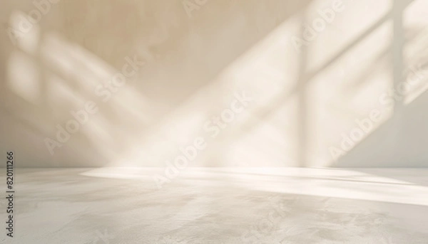 Fototapeta Empty abstract background in neutral beige colors for business product presentation. Geometrical shadows on wall for modern minimalist mockup backdrop.