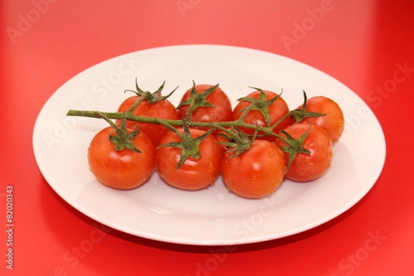 Obraz Isolated cluster of fresh ripe red cherry tomatoes