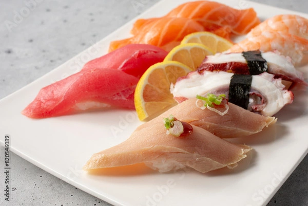 Fototapeta A view of a plate of assorted nigiri.