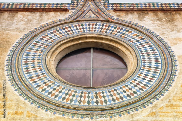 Fototapeta The window of a convent. Close up of a monastery facade.