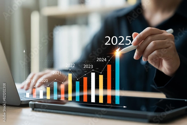 Fototapeta A businesswoman studies digital data to analyze positive business trends in 2025. This analysis reveals insights into business, marketing, and economic concepts.