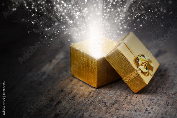 Obraz Magical gift with rays and sparks