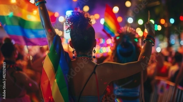 Fototapeta Festive atmosphere with live music and dancing at a nighttime pride event