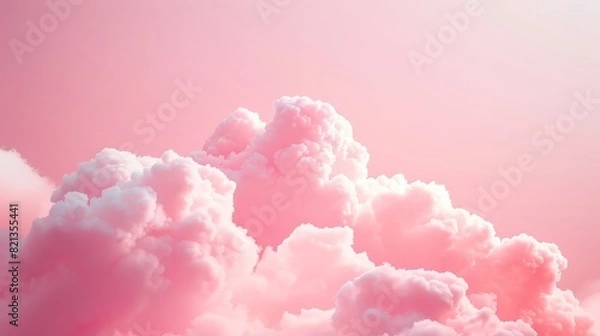 Fototapeta A pink cloud filled sky with a pink background