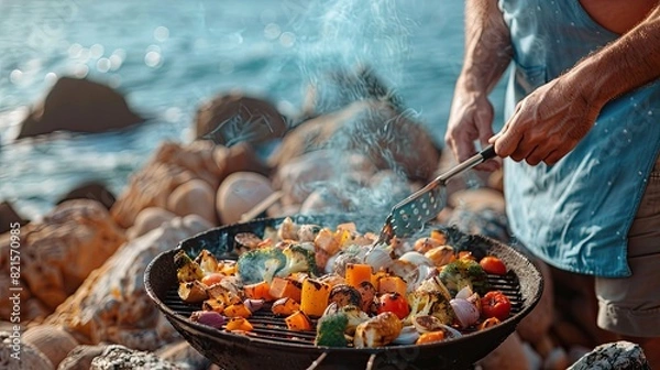 Fototapeta Outdoor Beach BBQ with Grilled Vegetables and Seafood in Scenic Coastal Setting