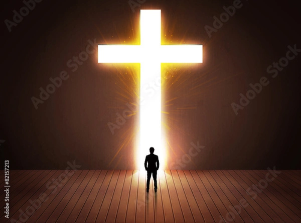 Fototapeta Man looking at bright cross sign