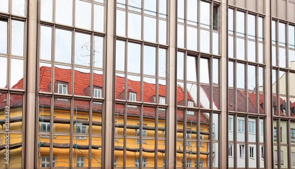 Fototapeta Old building architecture reflected in modern building
