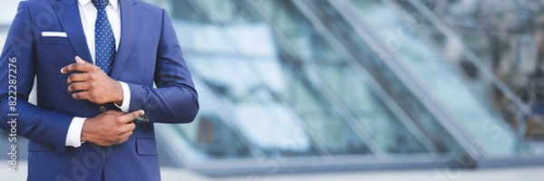 Fototapeta Business Life. Unrecognizable African American Man Adjusting Sleeve Cuff In City. Cropped, Free Space, Web-banner