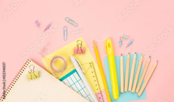 Fototapeta stationery items for girls or women on light pink background. Back to school. Female Student's, pupil's or engineer's supplies. Office objects on pastel pink background. Calculator, pen, pencil etc.
