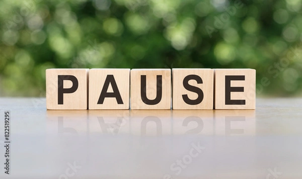 Fototapeta Wooden Block Spelling Pause on Table