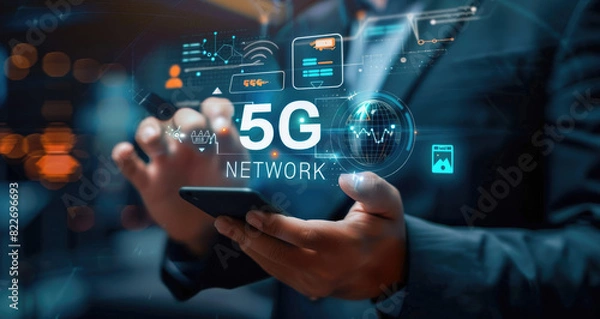 Fototapeta Businessman with 5G hologram on his hand and element of this image furnished, smart city and network connect concept
