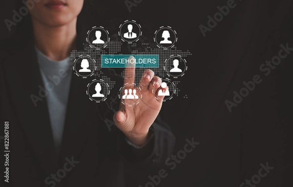 Fototapeta Stakeholders concept. Person touching stakeholders icon on virtual screen for business finance stakeholder investment management. Different stakeholders contact collaboration for company organization
