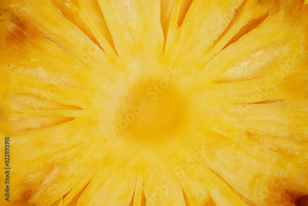 Obraz Summer fruit background concept, macro shot of juicy yellow pineapple slice texture