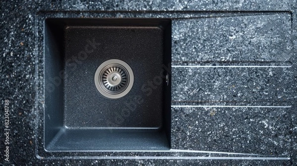Fototapeta Composite granite sink in a sleek, modern kitchen, close-up detail highlighting its texture and color variety, isolated background, studio lighting for clarity