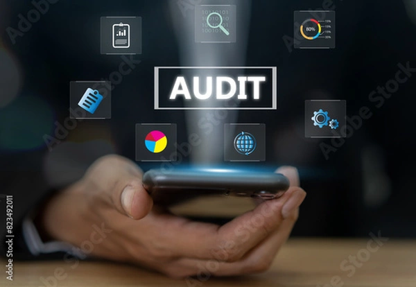 Fototapeta Business audit concept, businessman holding smartphone with business audits, financial reviews and corporate assessments, data analysis, financial reporting, auditing practices and performance metrics