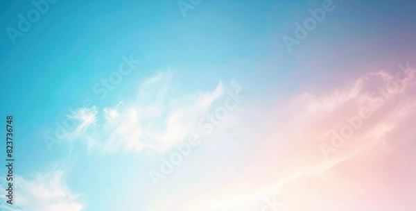 Fototapeta Pastel sky with soft delicate clouds and gradient from blue to pink. Panoramic image ideal for backgrounds, nature themed artwork and weather graphics