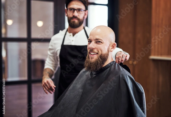 Fototapeta Portrait, client and man in barbershop with beard, cut and smile for trendy hairstyle at small business. Style, barber and customer in chair for grooming service, creative hair care and clean trim.