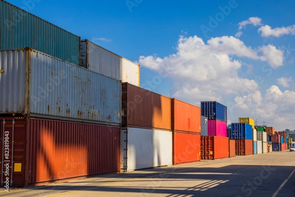 Obraz Containers stacked  - Shipping containers being unloaded at port facilities in Ashdod, Israel