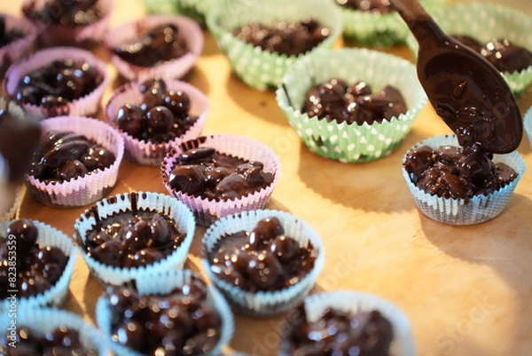 Obraz Almonds with melted dark chocolate