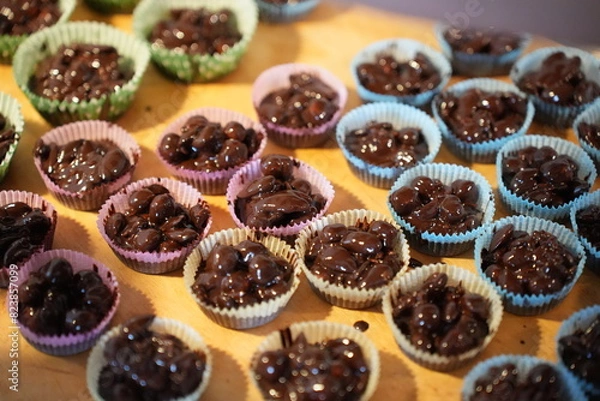 Obraz Almonds with melted dark chocolate