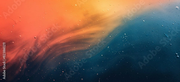 Fototapeta Gradient with noise overlay, transitioning from orange to dark blue, abstract background of space