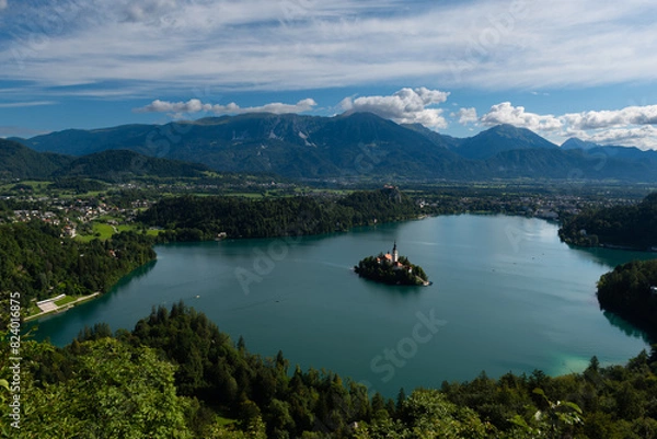 Fototapeta The famous and beautiful lake Bled with it’s signature small Bled Island with in the background Bled Castle on the high cliff, Bled, Slovenia